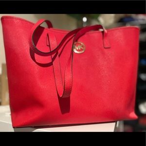 Orange/red Micheal kors bag.  Almost brand new, where 1-2 times.